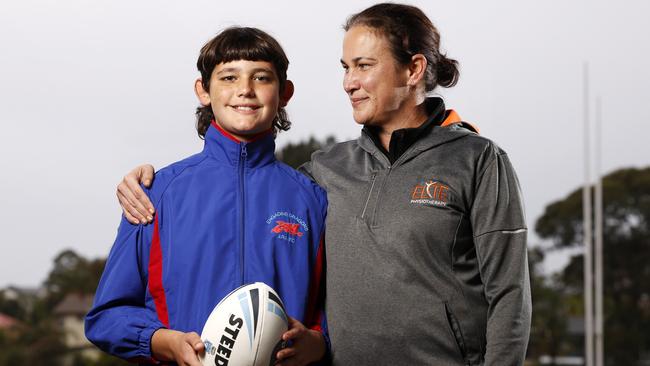 Footy mum and neurological physiotherapist Kate Watson with 12-year-old son Jacob. Picture: Jonathan Ng