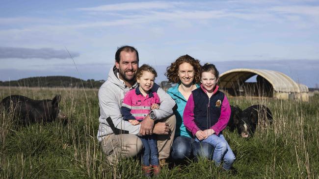 Kate and Mark Wheal, with their two daughters, Lily and Willow, on their mixed livestock and cropping property at Beachport, where they run 150 Berkshire sows to supply pork directly to butchers. Picture: Nicole Cleary