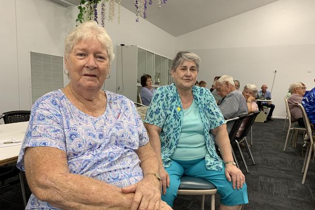 Joyce Macmillan (left) and Jenny Dickson sit and listen to the yearning country music at the Sarina Country Music Family Afternoon. Picture: Duncan Evans