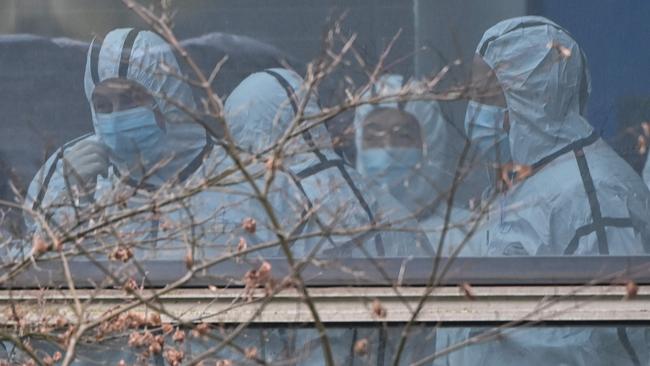 Members of the World Health Organisation (WHO) team investigate the origins of the coronavirus during their visit to the Hubei Center for animal disease control and prevention in Wuhan, China. Covid-19 was one of five relatively rare pandemic outbreaks in the past 120 years. Picture: Hector Retamal/AFP