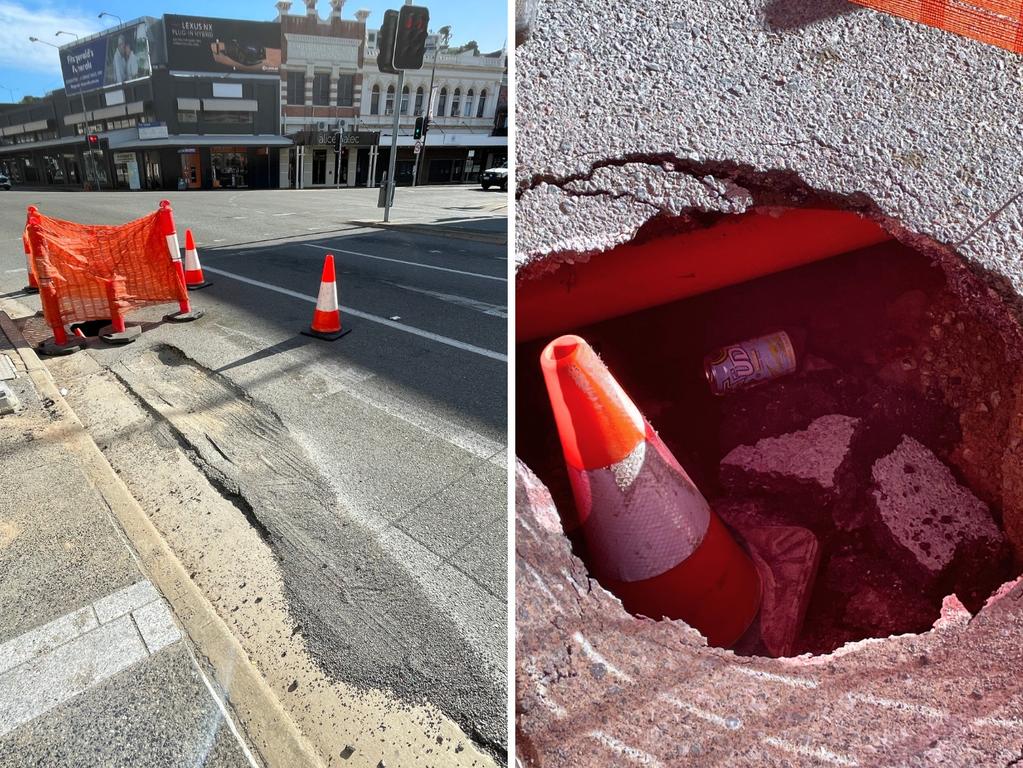 The sinkhole in Flinders St is about one witches' hat deep and opens down onto an orange pipe. Motorists say it first appeared as a pretty bad pothole about a week ago.
