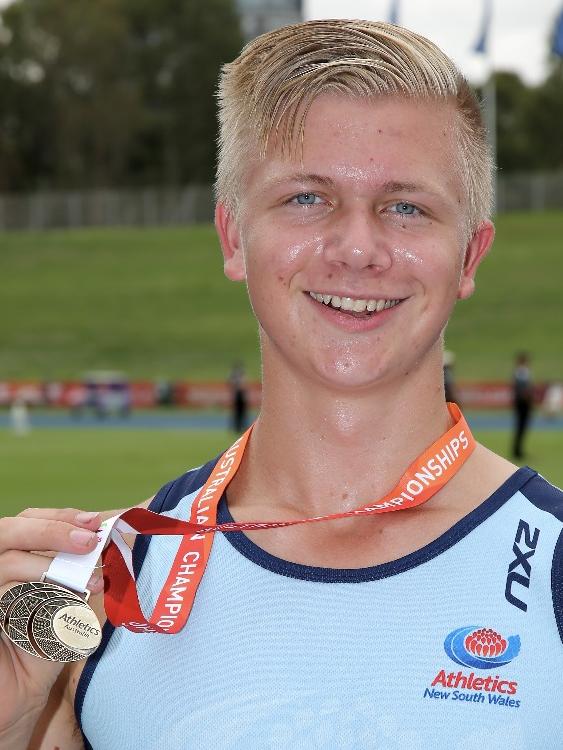 Nickolai receiving his gold medal at the national championships