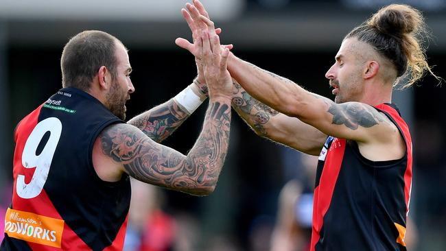 Dean Galea and Kame Ogilvie celebrate a goal for Riddell. Picture: Josh Chadwick