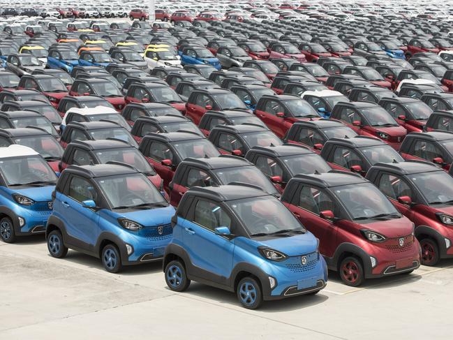 Roughly 80 per cent of the EVs sold in Australia are made in China. Baojun E100 electric vehicles are pictured above at a Chinese plant. Picture: Qilai Shen/ Bloomberg