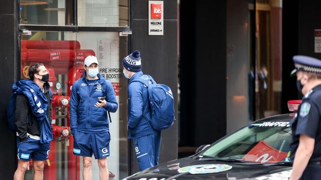 Geelong players leaving the Ibis Hotel on Friday morning. Picture: Russell Millard