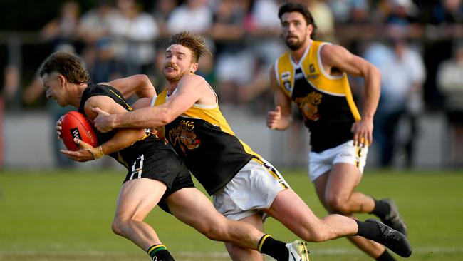 Jake Aarts of the Tigers is tackled by Brenton Lambert of the Stonecats during the 2023 MPFNL Division 1 Grand Final. (Photo by Josh Chadwick)