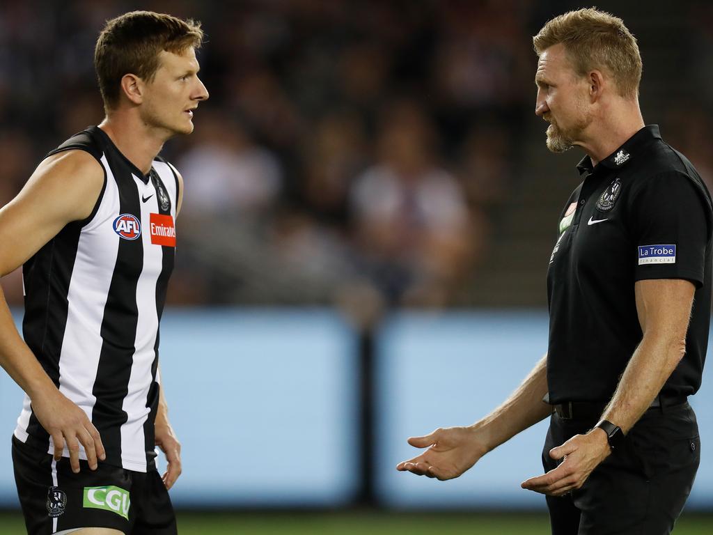 Will Hoskin-Elliott of the Magpies and Nathan Buckley. Getty.