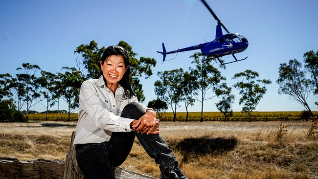 Helivista scenic flights owners, operations manager Mei Ling with her husband and pilot Paul Beck at Penny’s Hill Winery, McLaren Vale. Picture: Mike Burton