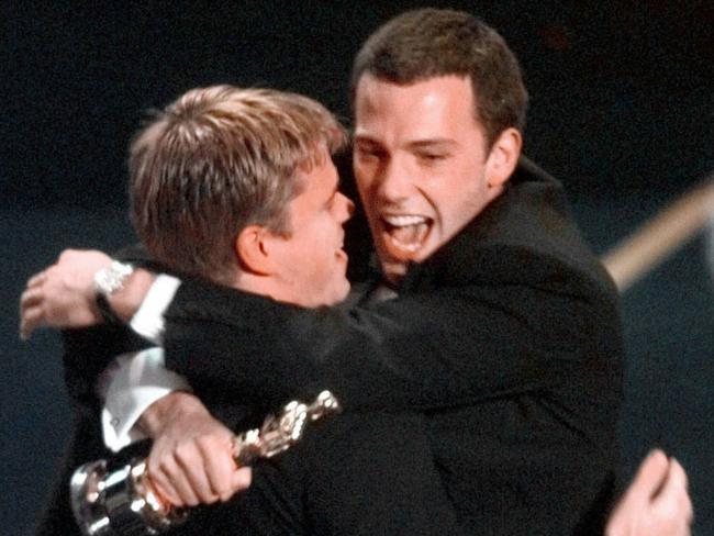 Matt Damon and Ben Affleck celebrate winning the Oscar for Best Original Screenplay. Picture: AP