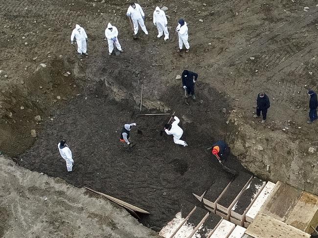 Preparing a burial pit on Hart Island. Picture: AP