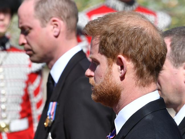 WINDSOR, ENGLAND - APRIL 17: Prince William, Duke of Cambridge; Prince Harry, Duke of Sussex and Peter Phillips walk behind Prince Philip, Duke of Edinburgh's coffin, carried by a Land rover hearse, in a procession during the funeral of Prince Philip, Duke of Edinburgh at Windsor Castle on April 17, 2021 in Windsor, United Kingdom. Prince Philip of Greece and Denmark was born 10 June 1921, in Greece. He served in the British Royal Navy and fought in WWII. He married the then Princess Elizabeth on 20 November 1947 and was created Duke of Edinburgh, Earl of Merioneth, and Baron Greenwich by King VI. He served as Prince Consort to Queen Elizabeth II until his death on April 9 2021, months short of his 100th birthday. His funeral takes place today at Windsor Castle with only 30 guests invited due to Coronavirus pandemic restrictions. (Photo by Mark Large-WPA Pool/Getty Images)