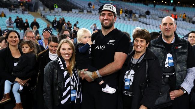 Sam Whitelock of the All Blacks poses with his wife Hannah Lawton and son after playing his 100th test. Picture: Getty Images