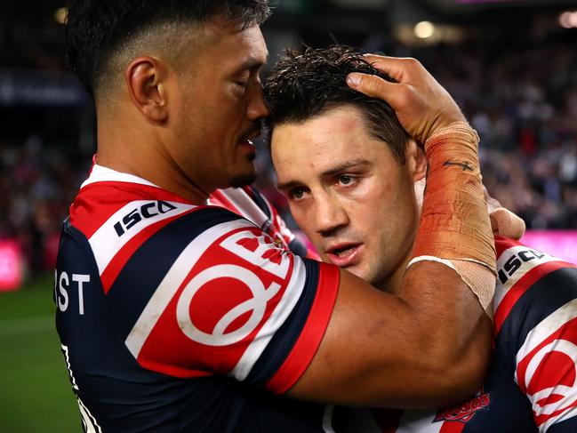 SYDNEY, AUSTRALIA - SEPTEMBER 22:  Zane Tetevano of the Roosters embraces team mate Cooper Cronk after winning the NRL Preliminary Final match between the Sydney Roosters and the South Sydney Rabbitohs at Allianz Stadium on September 22, 2018 in Sydney, Australia.  (Photo by Cameron Spencer/Getty Images)