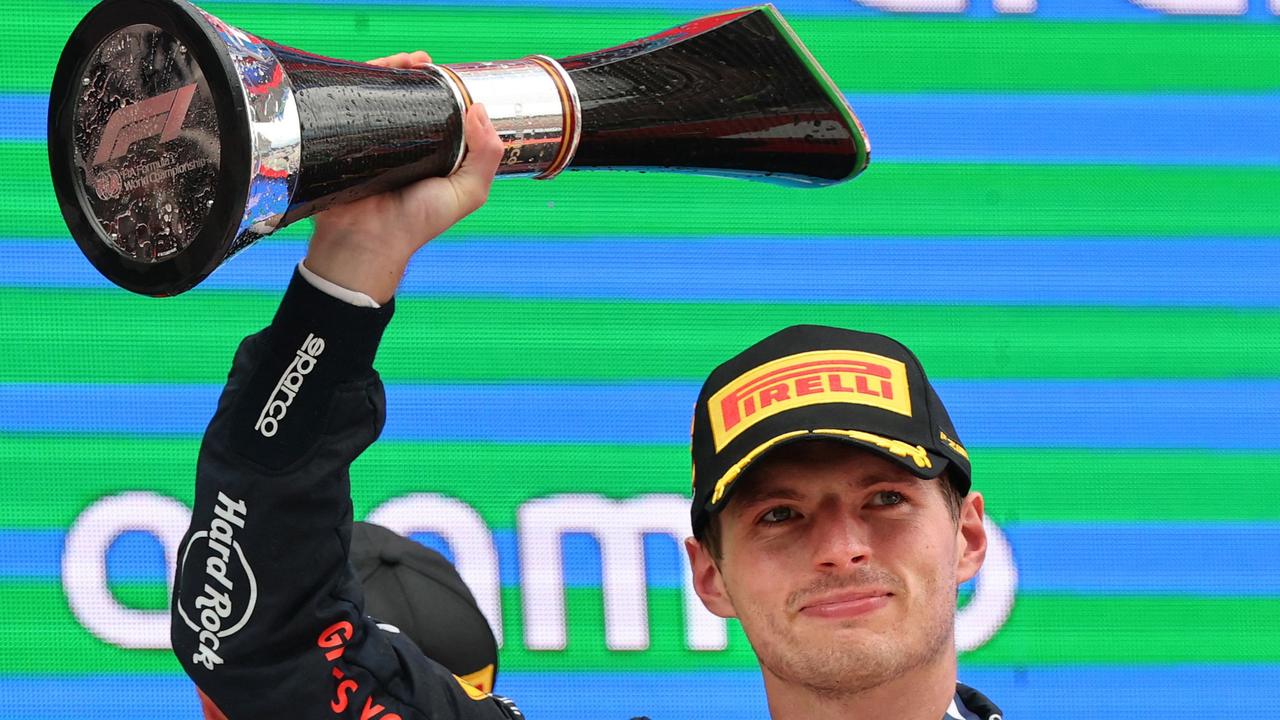 Verstappen collected yet another first place trophy. (Photo by Thomas COEX / AFP)