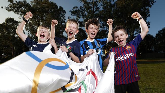 Isaac Walter, 9, Jesse Walter, 10, Cooper Chapman,9, and Campbell Chapman, 8, all from the Grange, were part of the video which helped win Brisbane the 2032 Olympic Games. Picture: Josh Woning