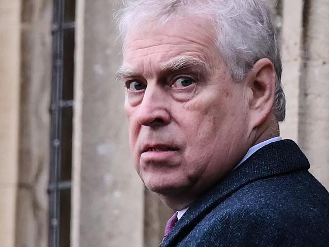 Britain's Prince Andrew, Duke of York reacts as he arrives for the Royal Family's traditional Christmas Day service at St Mary Magdalene Church in Sandringham, Norfolk, eastern England, on December 25, 2022. (Photo by Daniel LEAL / AFP)