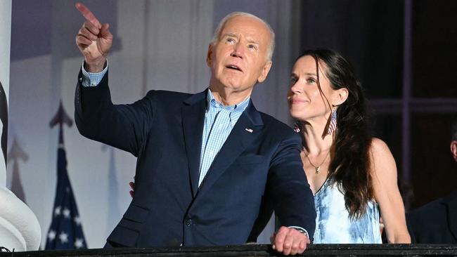 Ashley Biden stands with her father. US President Joe Biden. as they arrive to watch the Independence Day fireworks display from the Truman Balcony of the White House. Picture: AFP