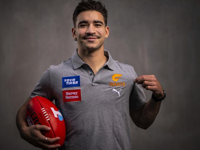 MELBOURNE, AUSTRALIA - OCTOBER 11: Toby Bedford poses for a photograph after he moved from the Melbourne Demons to the GWS Giants during the AFL Draft period, at AFL House on October 11, 2022 in Melbourne, Australia. (Photo by Daniel Pockett/Getty Images)