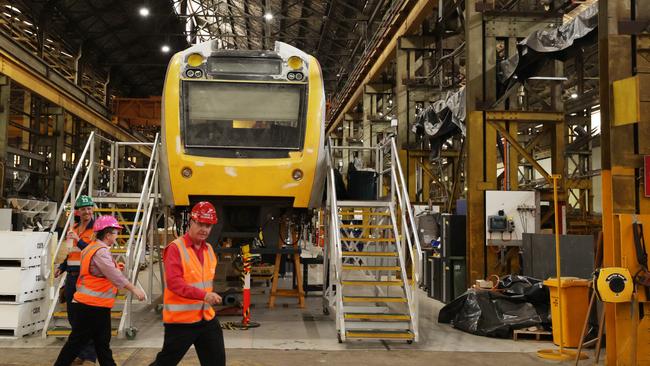 Workers inside the Downer Rail Manufacturing Facility at Maryborough. Picture Lachie Millard