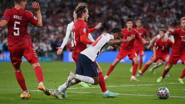 Raheem Sterling is fouled by Mathias Jensen inside the penalty area, leading to England's winning goal. (Photo by Laurence Griffiths/Getty Images)