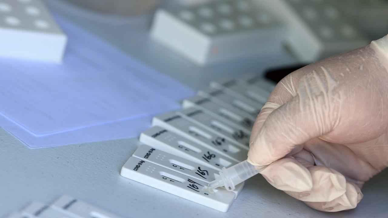 Another issue faced by pharmacists is that rapid test packs cannot be broken up into single tests, so those receiving free tests are receiving them in larger packets. (Photo by Rodrigo URZAGASTI / AFP)