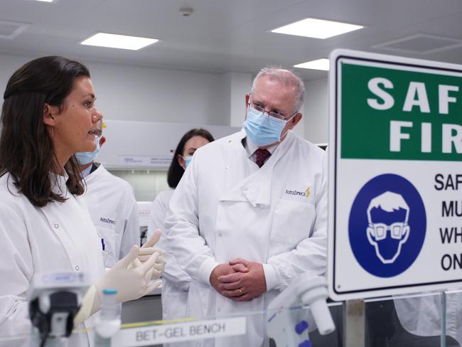 SYDNEY, AUSTRALIA - AUGUST 19: Prime Minister Scott Morrison meets with team member Savannah Alegre, Specialist Team Lead of the Microbiology Laboratory at AstraZeneca on August 19, 2020 in Sydney, Australia. The Australian government has announced an agreement with the British pharmaceutical giant AstraZeneca to secure at least 25 million doses of a COVID-19 vaccine if it passes clinical trials.  The University of Oxford COVID-19 vaccine is currently in phase-three testing. If the vaccine proves to be successful, Australia will manufacture and supply vaccines and will be made available for free. The project could deliver the first vaccines by the end of this year or by early 2021. (Photo by Lisa Maree Williams - Pool/Getty Images) *** BESTPIX ***