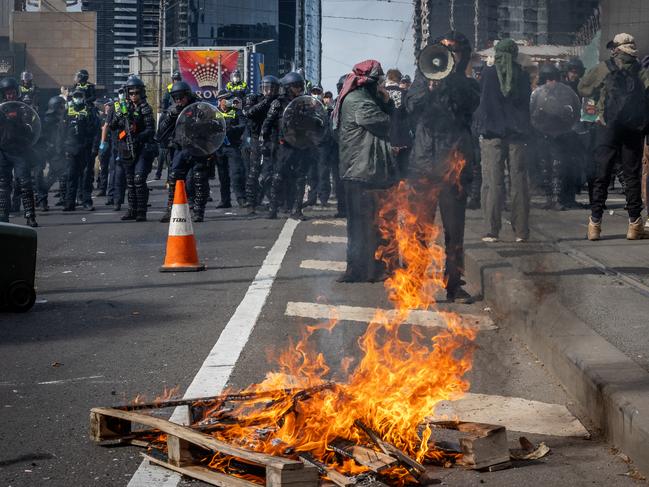 Anti-war activists protest the Land Forces 2024 International Land Defence Exposition at the Melbourne Convention and Exhibition Centre. Protesters attempt to establish a barricade on Clarendon Street Bridge. Picture: Jake Nowakowski