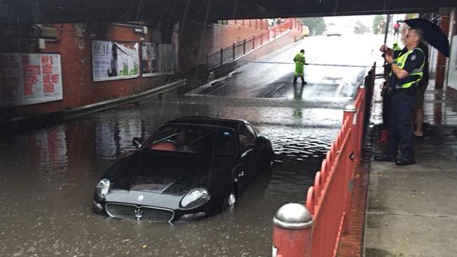 A Maserati that was flooded after the driver attempted to navigate a flooded underpass at Victoria Street in Seddon on Saturday. Picture: AAP Image/Supplied/Sarah Schubert