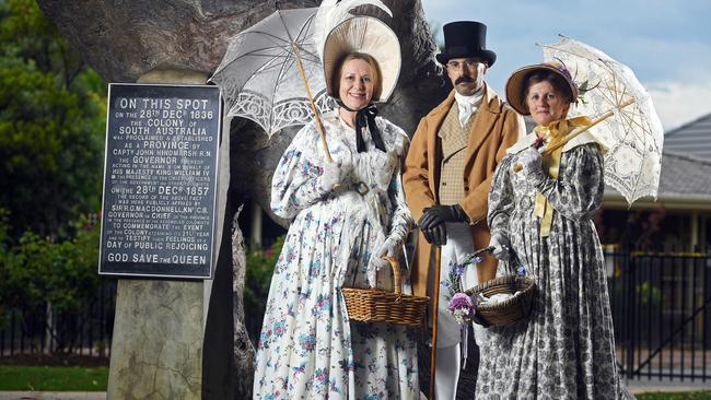 Linda Russo, Rui Barroso and Tricia Hardiman dressed in period costume in front of the historic Old Gum Tree in Glenelg North to celebrate Proclamation Day. Picture: Tom Huntley