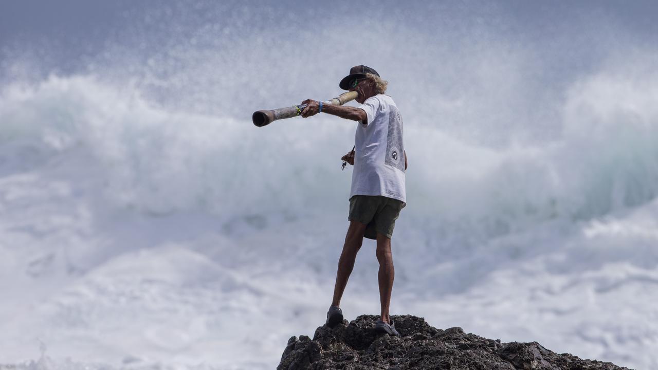 Snapper Rocks local Aboriginal identity Russell Corowa blessing the ocean on Sunday 2 January 2022. Picture: Jerad Williams