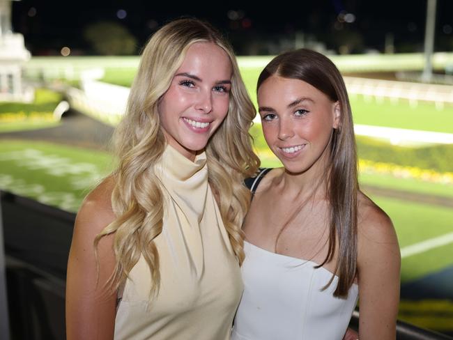 Jasmin Nagy and Violet Soulsby at Magic Millions Twilight Racing at Gold Coast Turf Club for Gold Coast at Large. Picture, Portia Large.