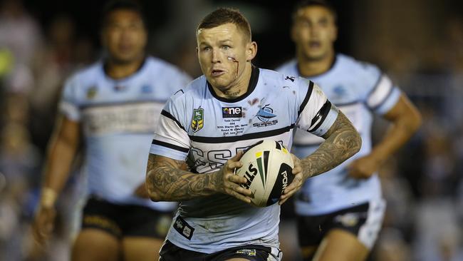 Todd Carney on the attack for Cronulla.