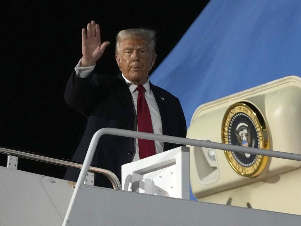 President Donald Trump waves as he boards Air Force One at the Naval Air Station Joint Reserve Base in New Orleans, late on Sunday (US time). Picture: AP