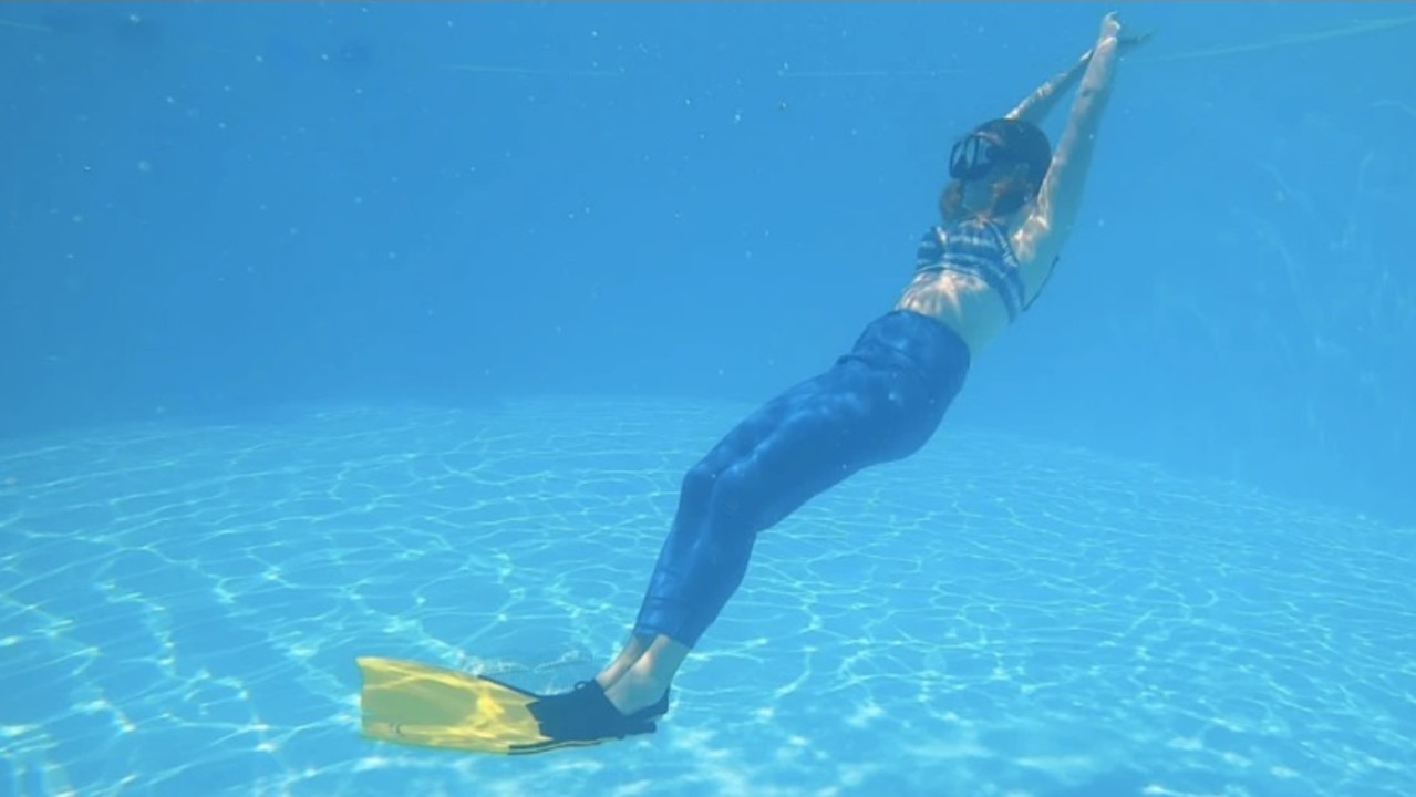 We’re soon zooming around under water, giving each other high fives at three metres deep. Picture: Supplied