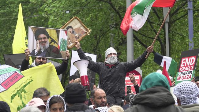 Protesters display Hezbollah flags and pictures of slain leader Hassan Nasrallah at a Melbourne rally on September 29. Picture: Valeriu Campan/NewsWire