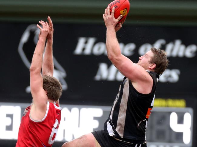 Mitch Collins takes a mark for Belgrave.