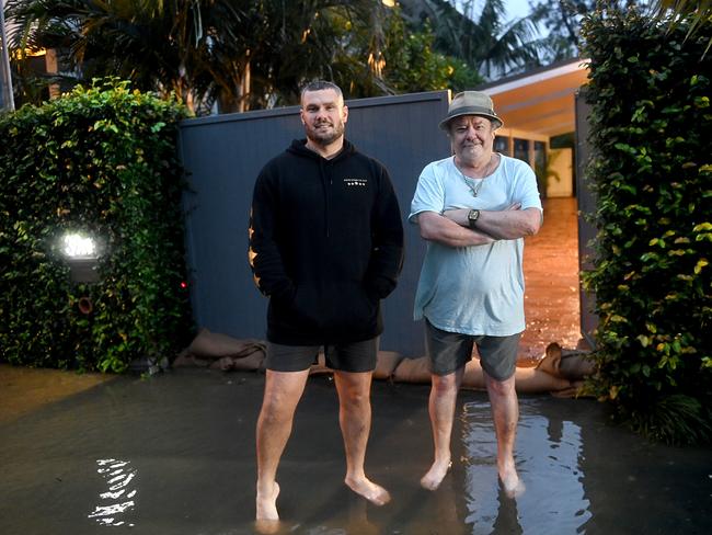 INXS member Tim Farriss and son James outside their Narrabeen home on Tuesday night after an evacuation order was made. Picture: Jeremy Piper