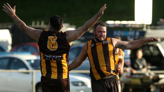 NFL: Alex Hywood and Dan Offer celebrate a goal for Heidelberg West. Picture: Hamish Blair