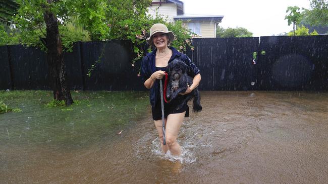 Toni Wright rescues little Louis from 9th Avenue Railway Estate on Sunday. Picture: Adam Head