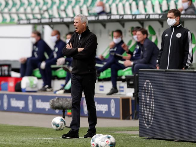 Dortmund's Swiss coach Lucien Favre stands by the touchline during the German first division Bundesliga football match Vfl Wolfsburg vs Borussia Dortmund in Wolfsburg, on May 23, 2020. (Photo by Michael Sohn / POOL / AFP) / DFL REGULATIONS PROHIBIT ANY USE OF PHOTOGRAPHS AS IMAGE SEQUENCES AND/OR QUASI-VIDEO