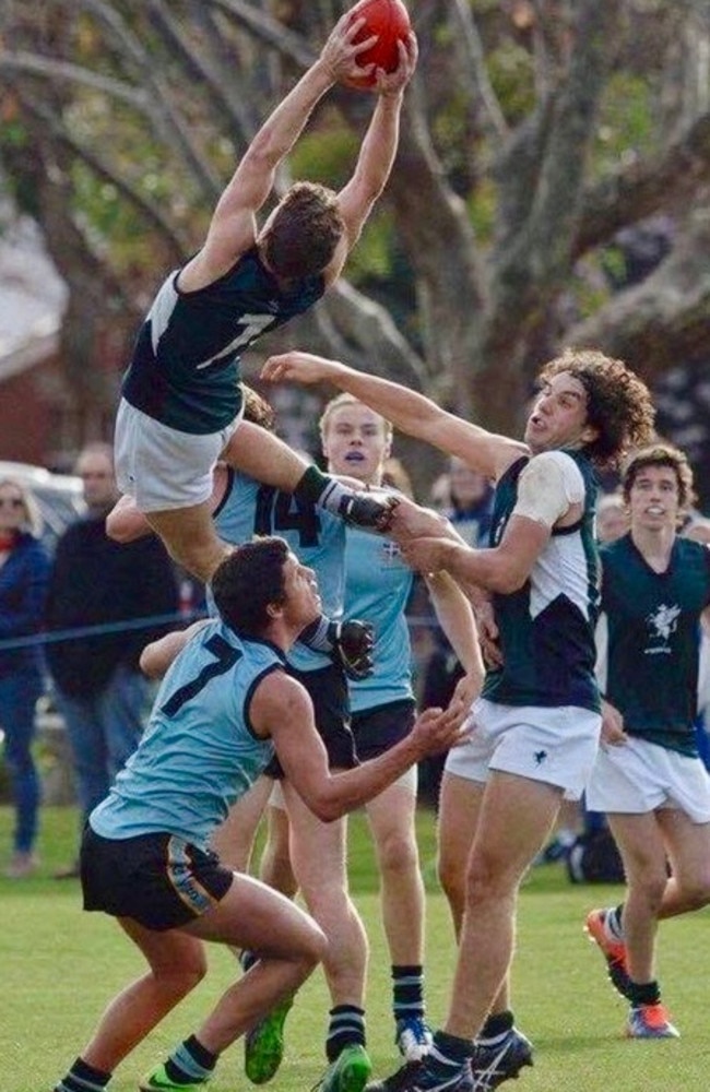 Jack Henderson soars for a huge hanger playing for Geelong College. Picture: Drew Ryan