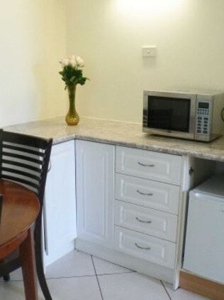 The clean kitchenette pictured on the website. Picture: Supplied