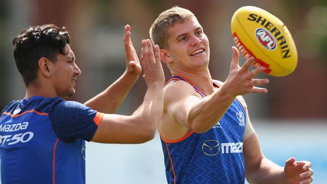 MELBOURNE, AUSTRALIA - MARCH 23: Jed Anderson of the Kangaroos is challenged for the ball by Robin Nahas during a North Melbourne Kangaroos AFL training session at Arden Street Ground on March 23, 2016 in Melbourne, Australia. (Photo by Robert Cianflone/Getty Images)
