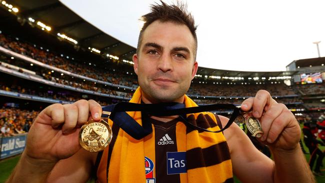 Brian Lake with his Norm Smith and premiership medals in 2013. Picture: Michael Wilson