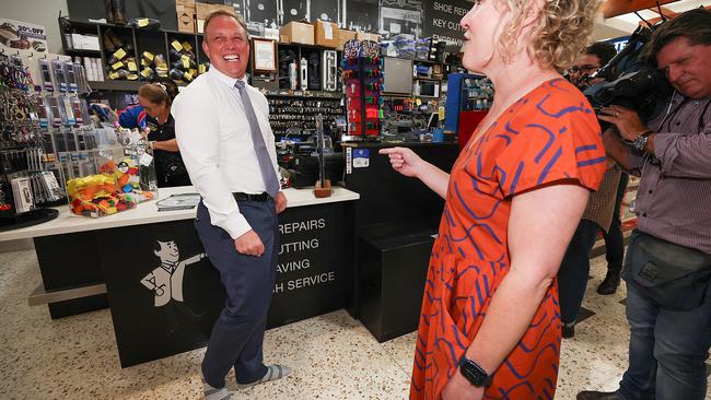 Premier Steven Miles visits Caneland Central in Mackay where Scott Mauchline from Mister Minit cleans the Premier’s shoes. Picture: Adam Head