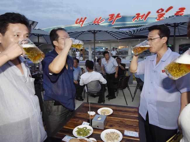 People drink beer during North Korea’s first beer festival in Pyongyang last year, in line with Kim Jong Un’s promise to improve living standards and build a “highly civilized nation”.