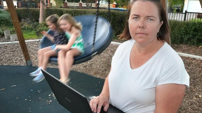 Paige Cross at Broadview playground with daughters, Amelia,9, and Madeline,6. Parent survey results  found that 17.9 per cent of parents find no time for things that they enjoy and 30 per cent found less than 30 minutes a day. 20 February 2025. Picture: Dean Martin