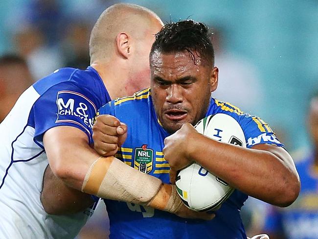 SYDNEY, AUSTRALIA - APRIL 29: Junior Paulo of the Eels is tackled during the round nine NRL match between the Parramatta Eels and the Canterbury Bulldogs at ANZ Stadium on April 29, 2016 in Sydney, Australia. (Photo by Mark Nolan/Getty Images)