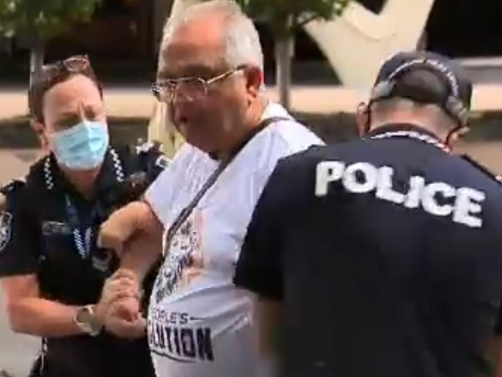 Queensland Police making arrests during Brisbane's three-day lockdown for not wearing a mask. Picture: Nine News Queensland