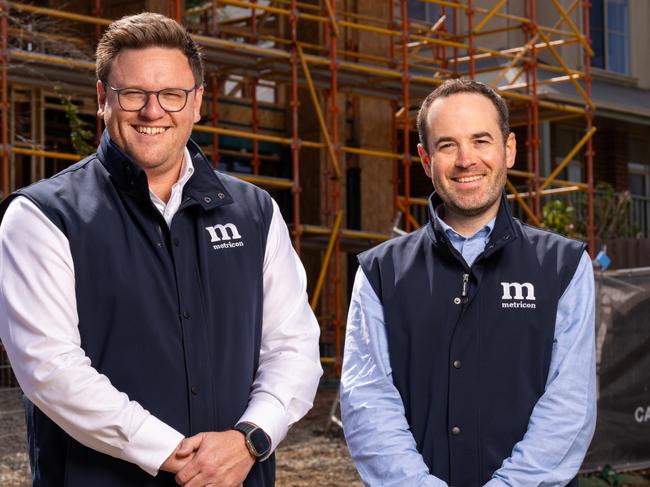 Metricon chief executive Brad Duggan and chief financial officer Jon Robson at a housing construction site - for herald sun real estate